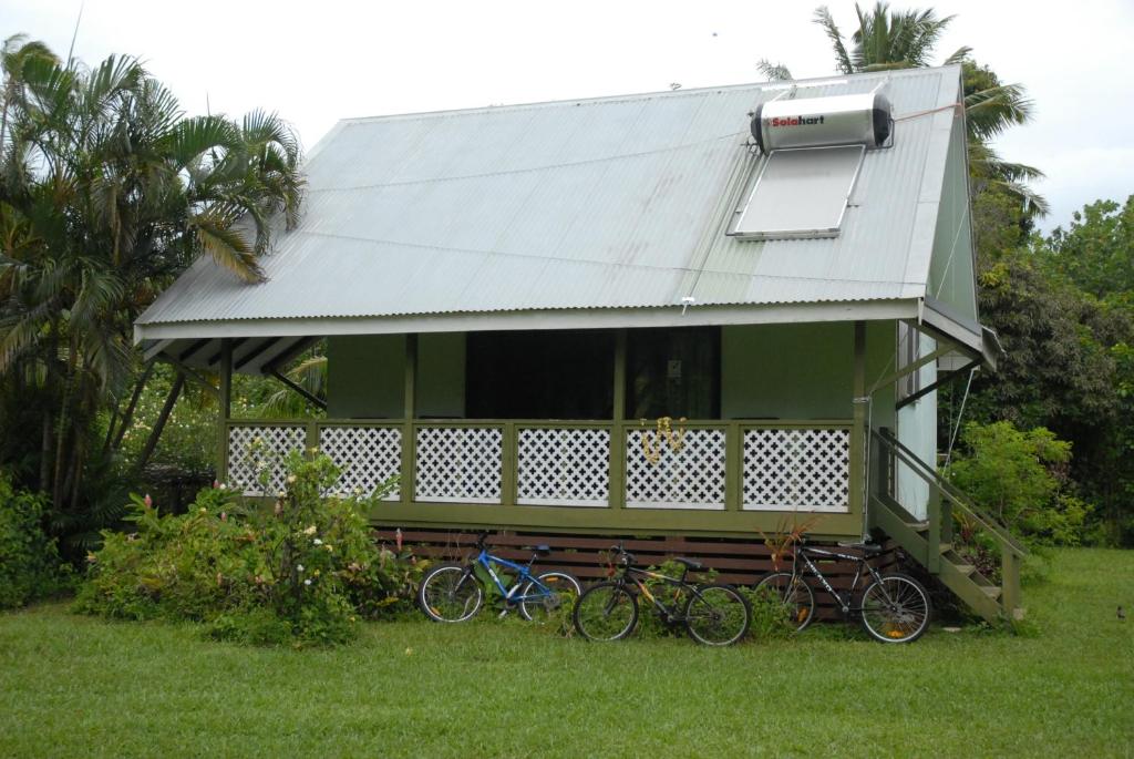 a group of bikes parked in front of a house at Ginas Garden Lodges, Aitutaki - 4 self contained lodges in a beautiful garden in Arutanga