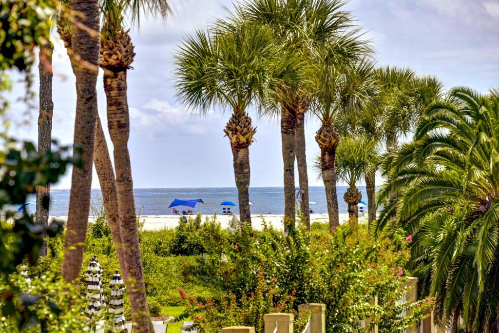 a view of a beach with palm trees and the ocean at Peaceful Ocean Retreat in East End