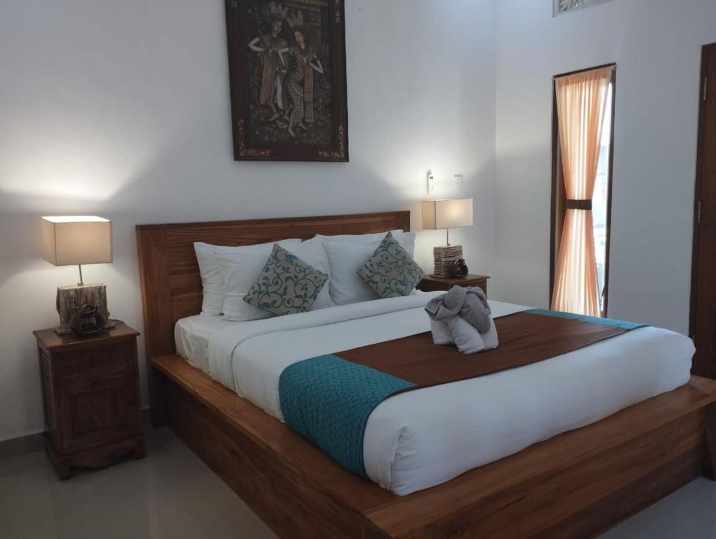 Postel nebo postele na pokoji v ubytování Bupala Guest House