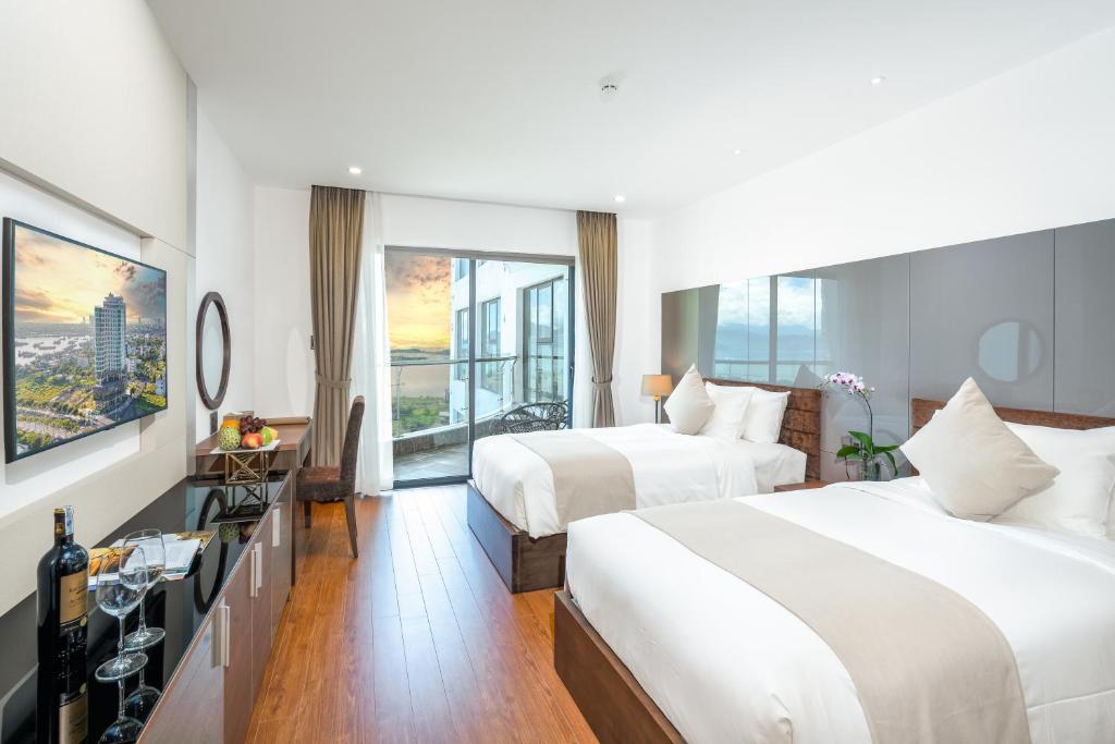 Postel nebo postele na pokoji v ubytování Alan Sea Hotel Danang