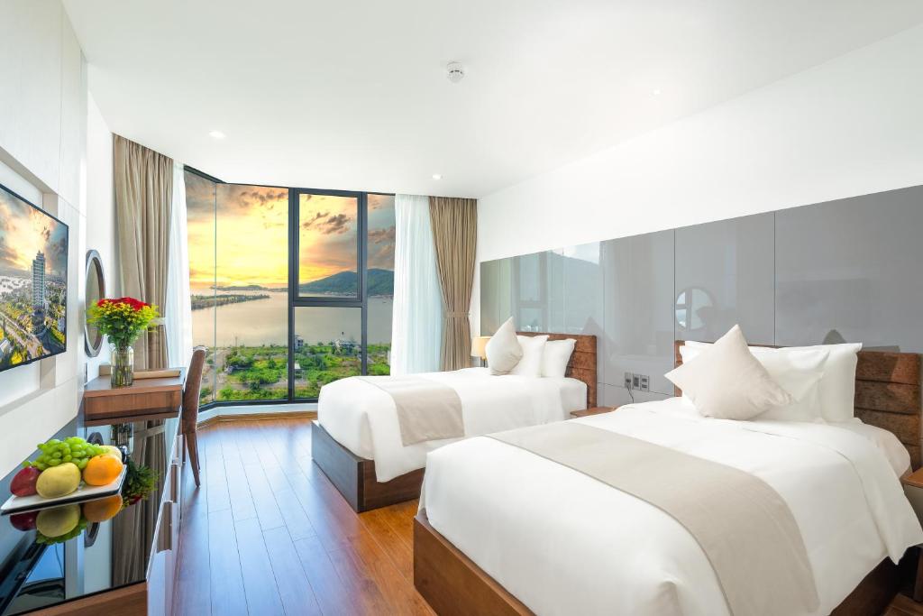 Postel nebo postele na pokoji v ubytování Alan Sea Hotel Danang
