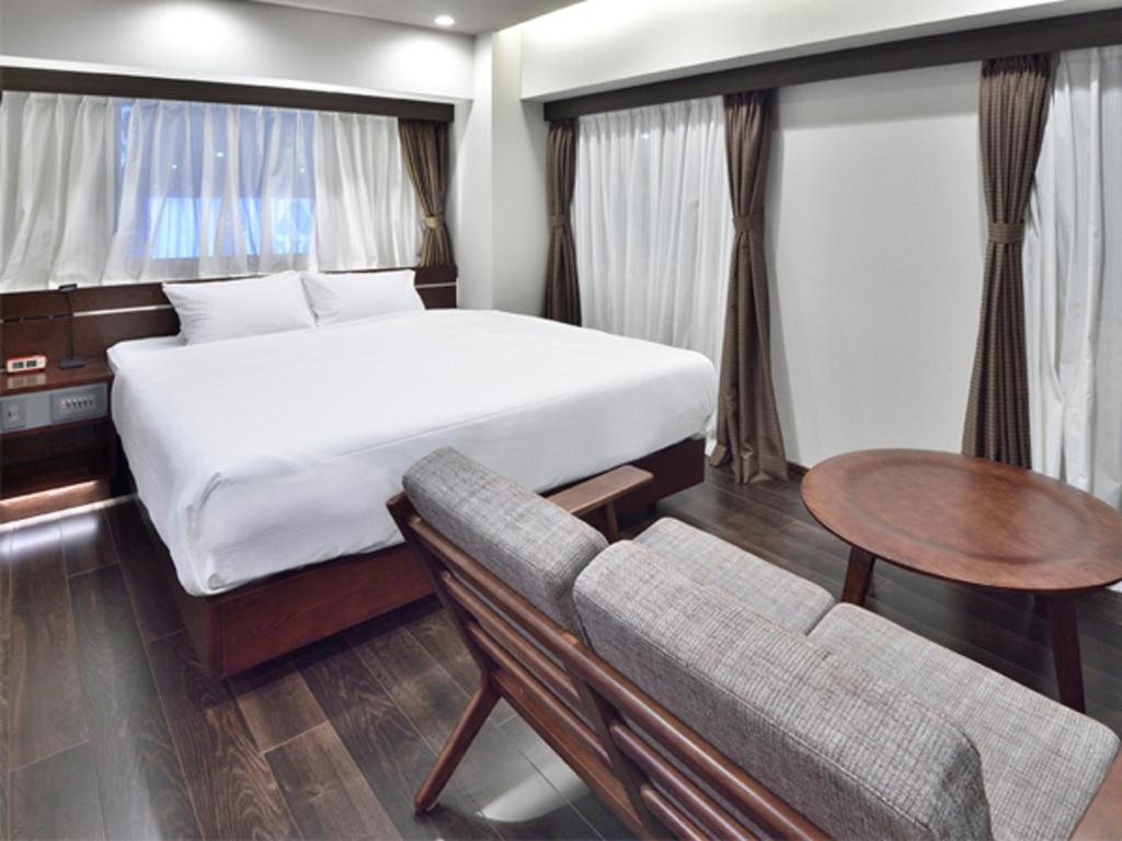Postel nebo postele na pokoji v ubytování BREATH HOTEL