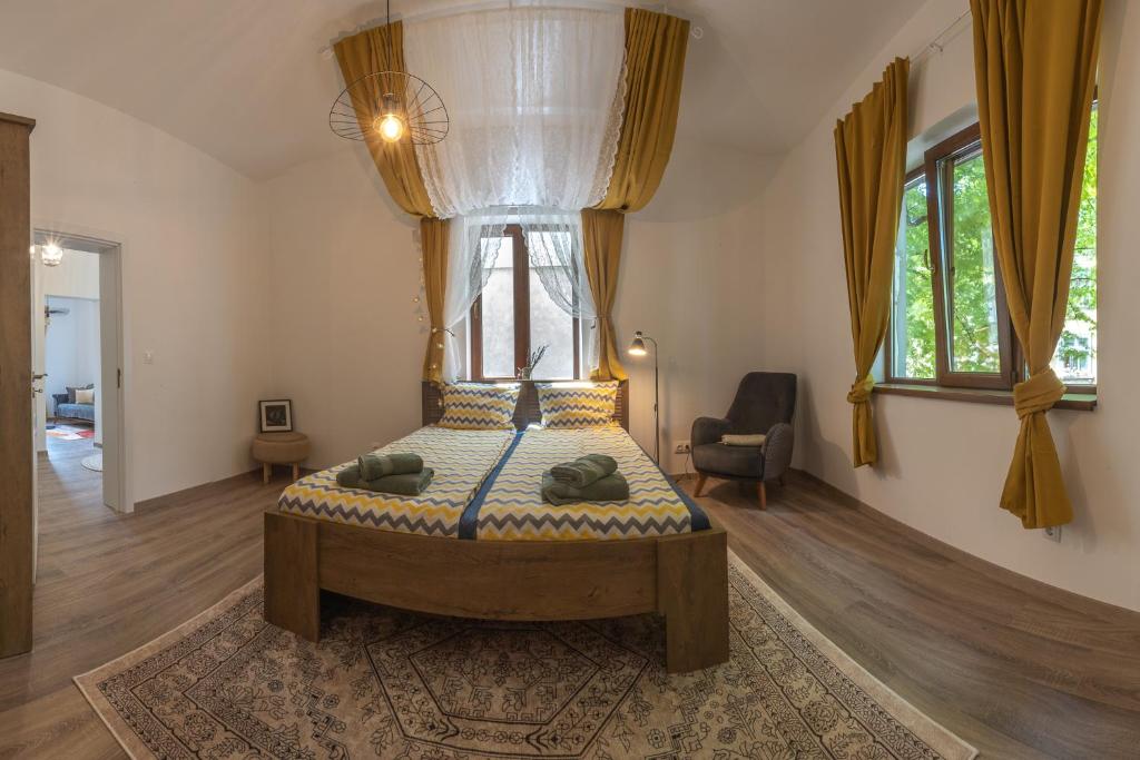 a bedroom with a bed with a canopy at Linden House - A lovely apartment in central Varna in Varna City