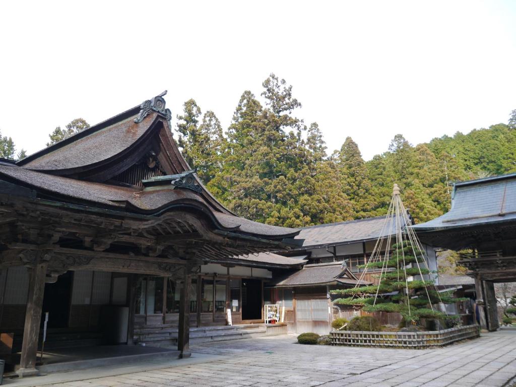 a building with a christmas tree in front of it at Kongo Sanmaiin in Koyasan
