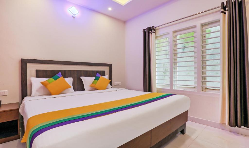 Postel nebo postele na pokoji v ubytování Itsy Hotels Kottaram Residency