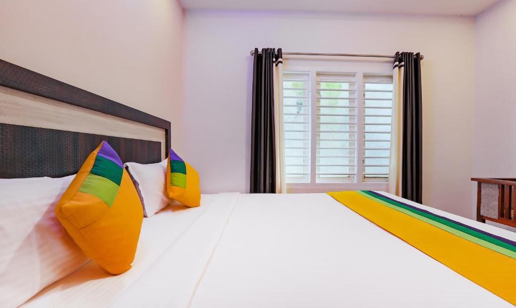Postel nebo postele na pokoji v ubytování Itsy Hotels Kottaram Residency