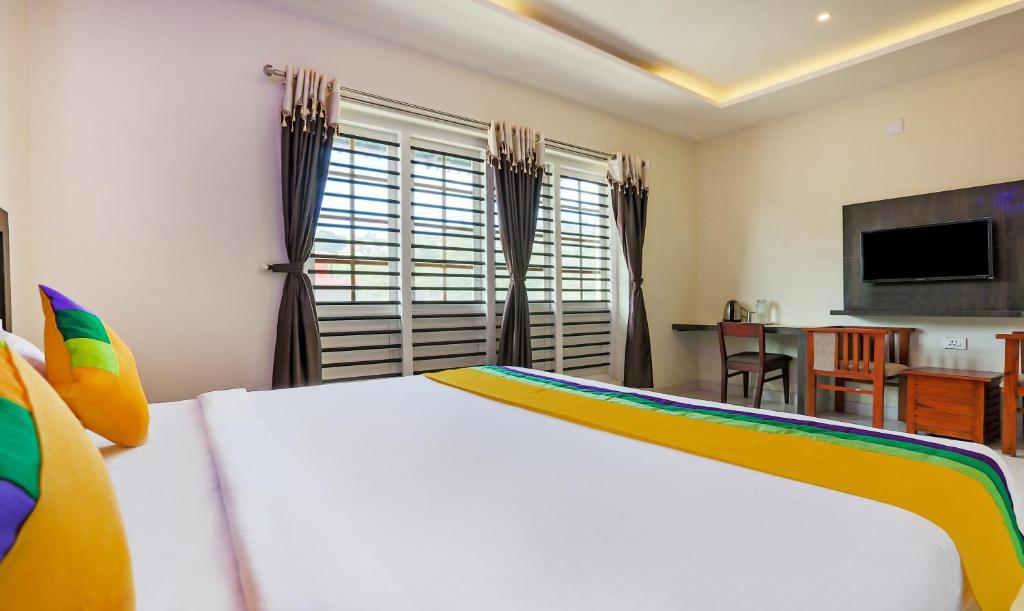Postel nebo postele na pokoji v ubytování Itsy Hotels Kottaram Residency