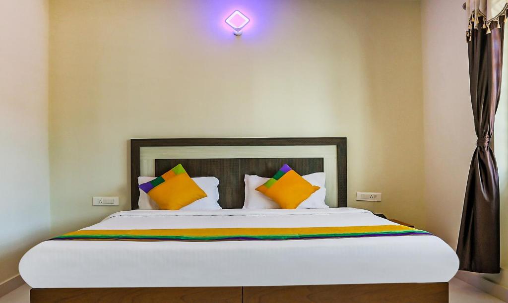 Postel nebo postele na pokoji v ubytování Itsy Hotels Kottaram Residency