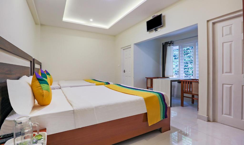 Postel nebo postele na pokoji v ubytování Itsy Hotels Kottaram Residency