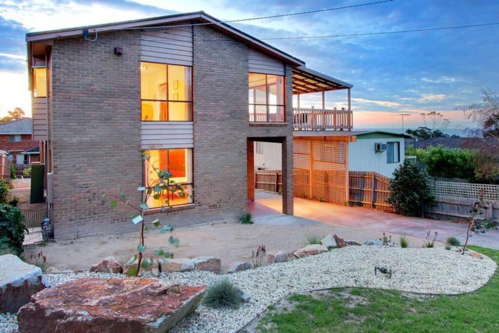 a brick house with a lot of windows at Dromana Panoramic Views in Dromana