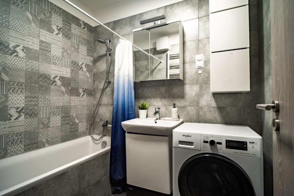 A bathroom at Vig Apartment - with Private Parking