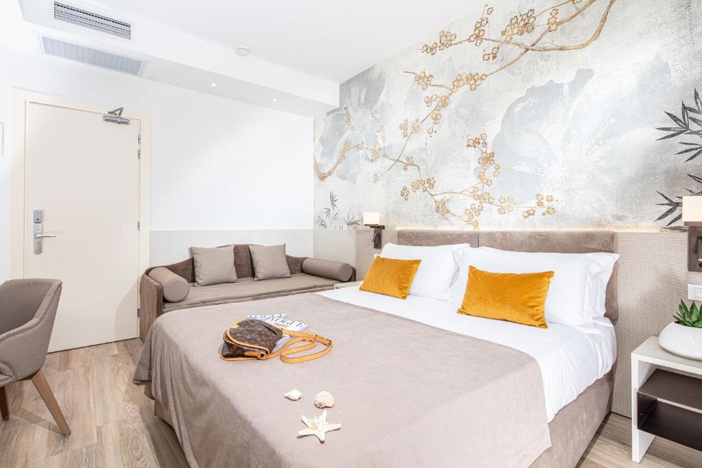 Postel nebo postele na pokoji v ubytování Hotel Excelsior