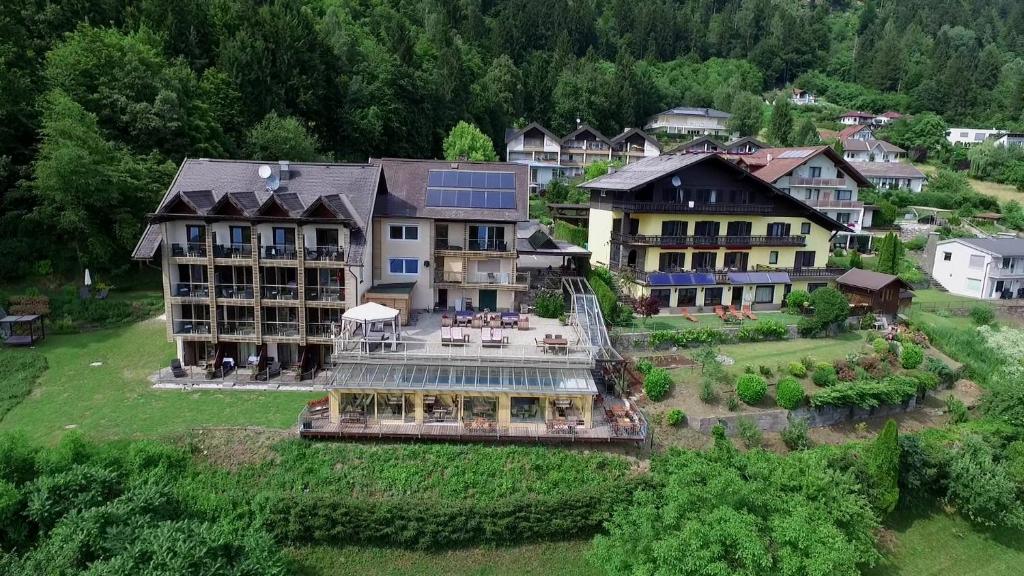 an aerial view of a large house in a village at Jägerhotel in Annenheim