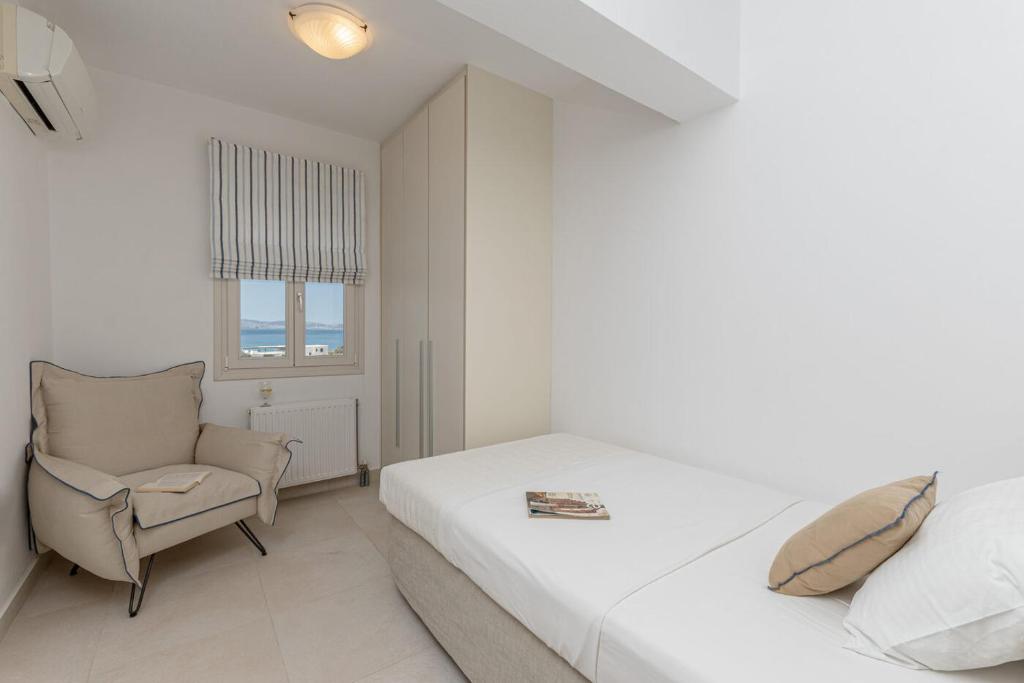 Postel nebo postele na pokoji v ubytování Orkos Beach Hotel