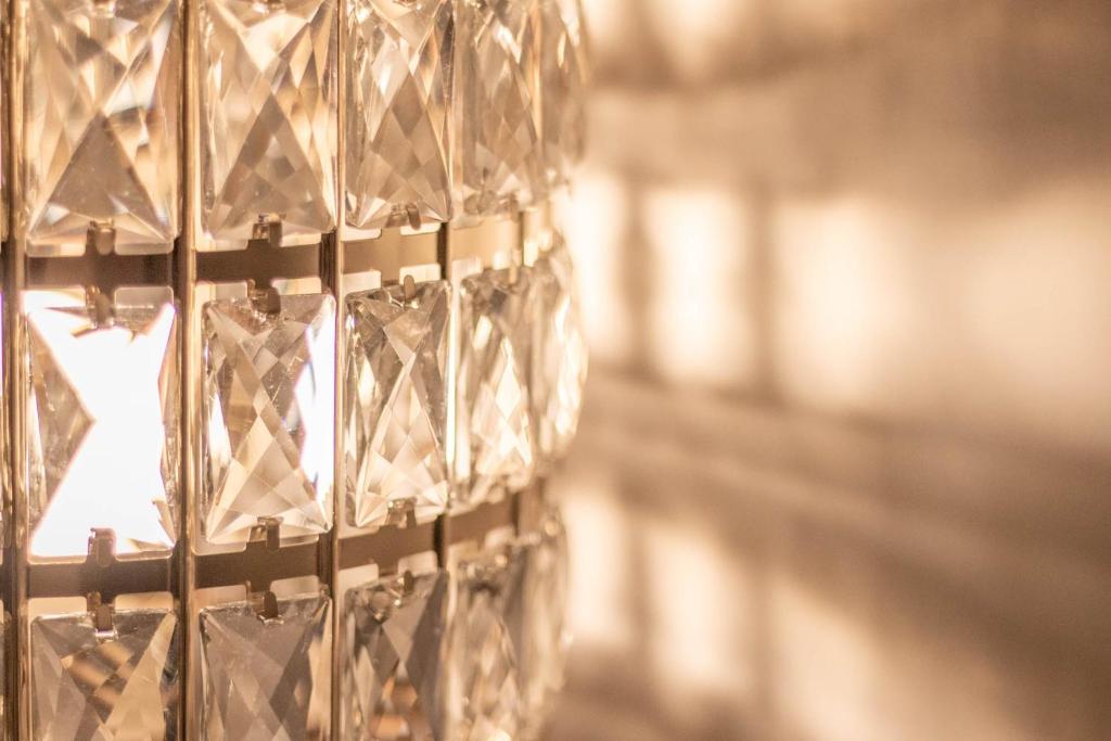 a bunch of wine glasses hanging from a wall at DANY GUEST HOUSE in Rome