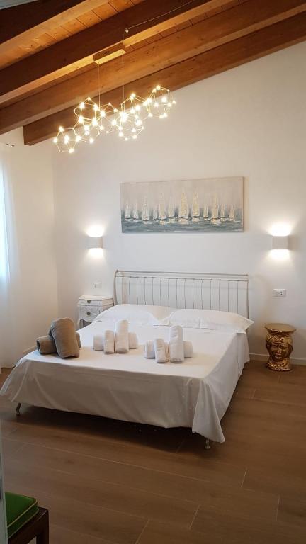 A bed or beds in a room at Agriturismo Resort Il Foionco