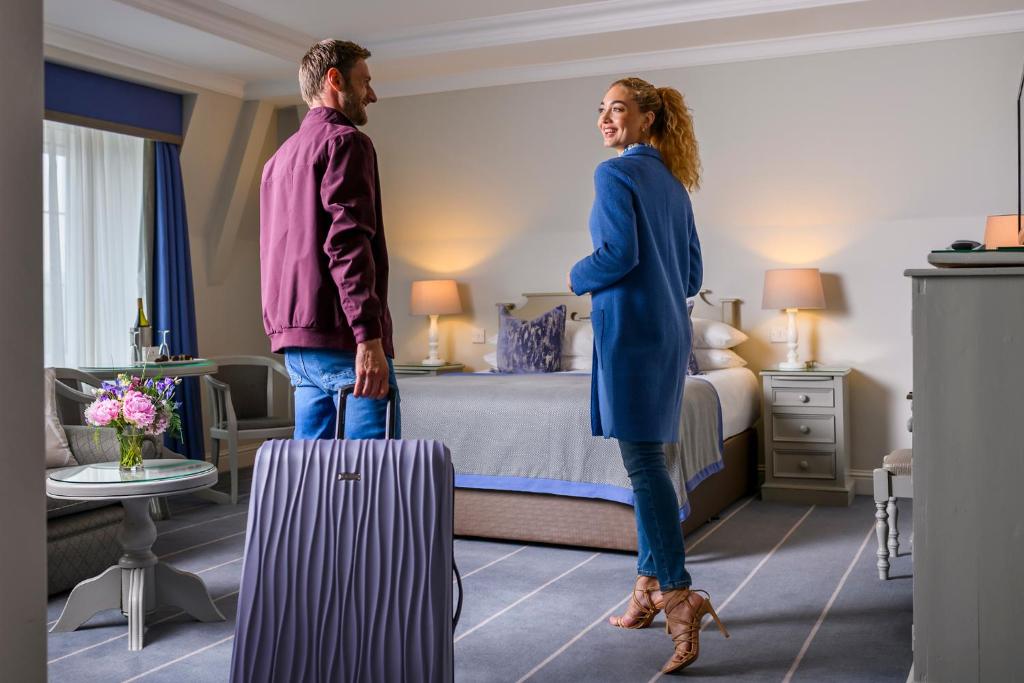 Voodi või voodid majutusasutuse Meadowlands Hotel toas
