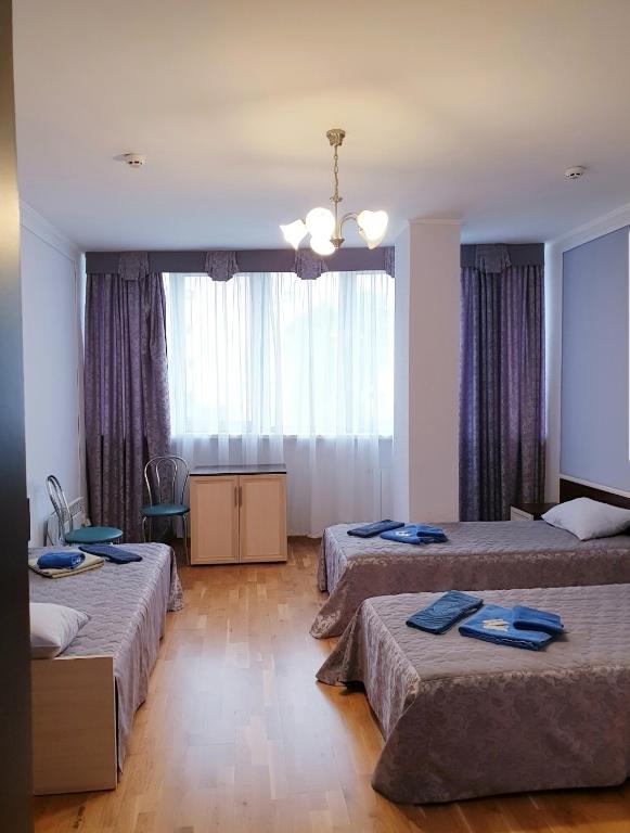 Postel nebo postele na pokoji v ubytování Hotel Obolon-Arena