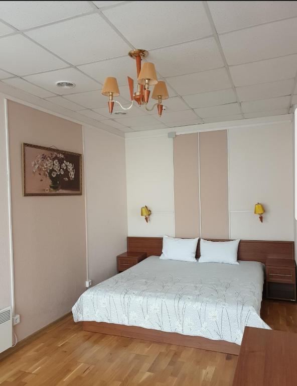 Postel nebo postele na pokoji v ubytování Hotel Obolon-Arena