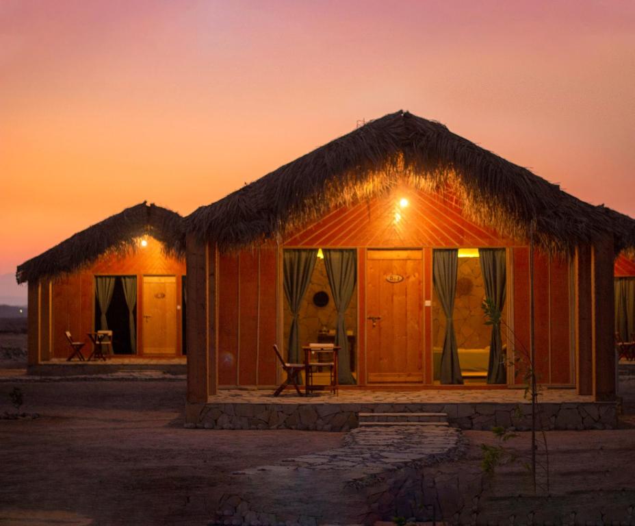 a small hut in the desert at sunset at SAMA Ras Al Jinz Resort in Sur
