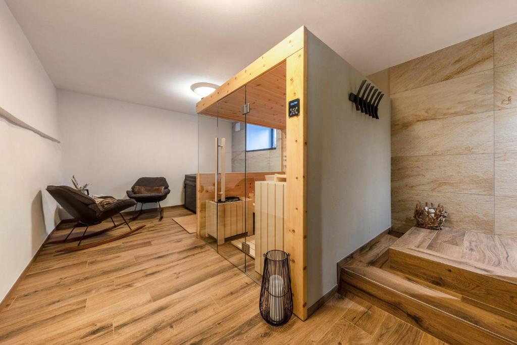 a room with wooden flooring and a glass wall at Apartment Ub31 One in Eggen