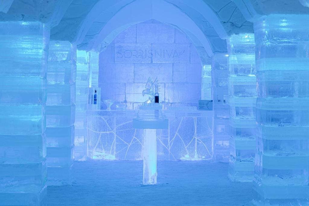 a room full of ice blocks with a sink in it at Sorrisniva Igloo Hotel in Alta