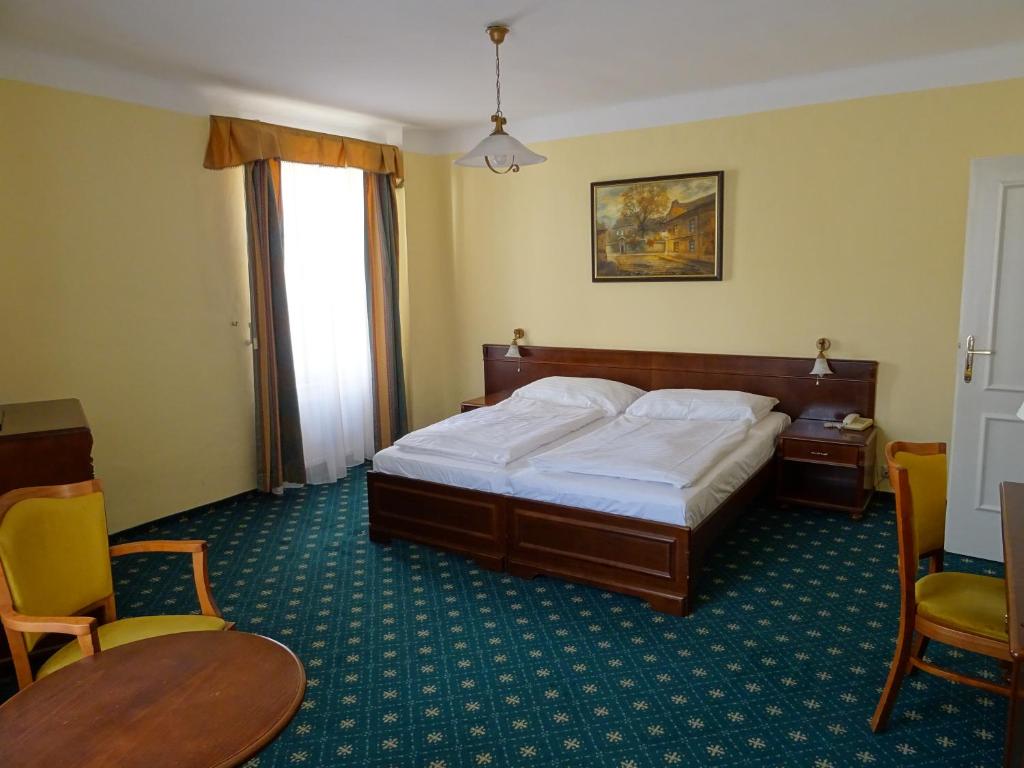 Postel nebo postele na pokoji v ubytování Hotel Certovka