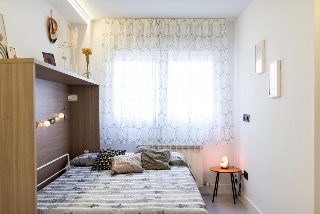 Posteľ alebo postele v izbe v ubytovaní Apartamento inteligente con vistas a la Alhambra