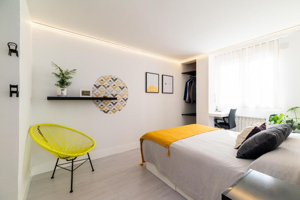 Posteľ alebo postele v izbe v ubytovaní Apartamento inteligente con vistas a la Alhambra