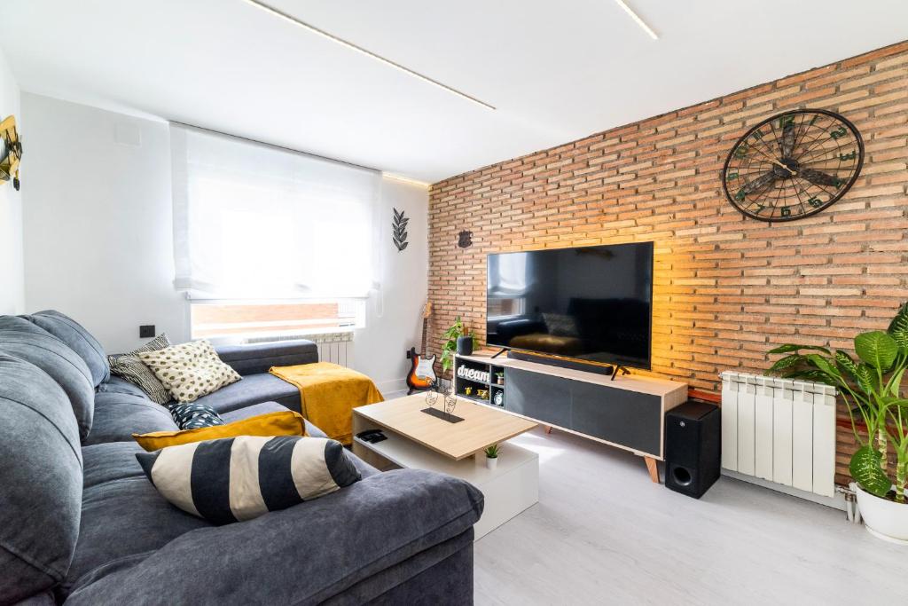 Televízia a/alebo spoločenská miestnosť v ubytovaní Apartamento inteligente con vistas a la Alhambra