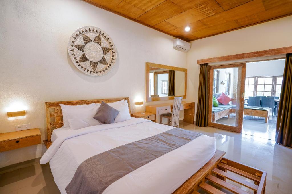 Ένα ή περισσότερα κρεβάτια σε δωμάτιο στο The Catur Villa Seminyak