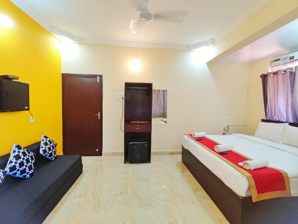Postel nebo postele na pokoji v ubytování Hotel Candolim Aloft