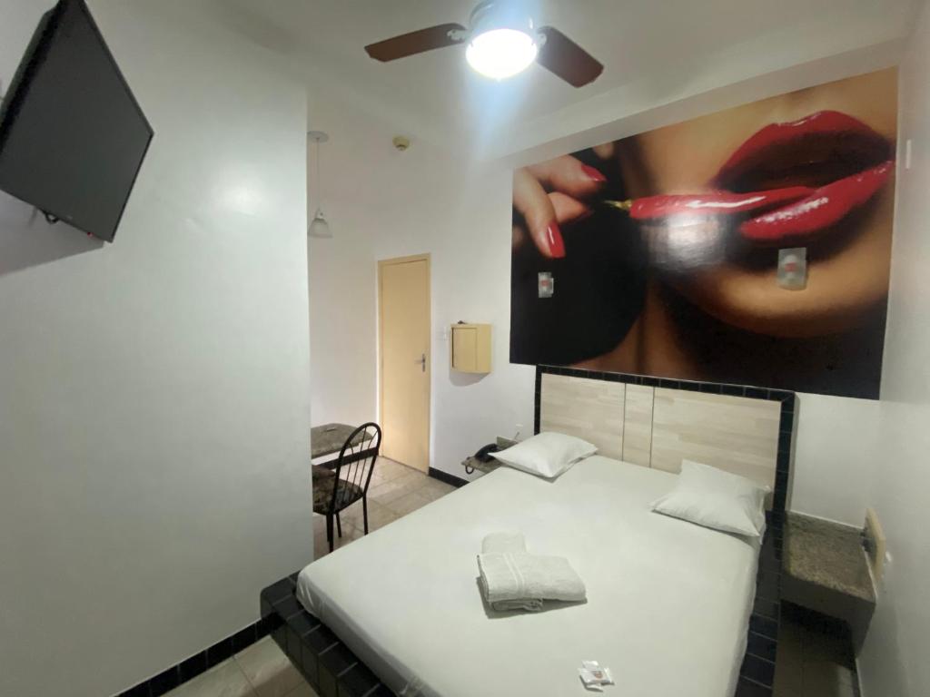 Postel nebo postele na pokoji v ubytování Hotel Bom Gosto