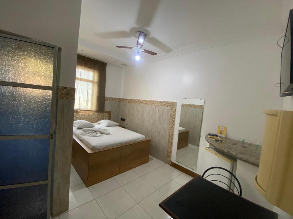 Postel nebo postele na pokoji v ubytování Hotel Bom Gosto