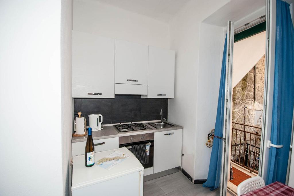 Kuchyň nebo kuchyňský kout v ubytování Casa Di Mezzo by Arbaspàa