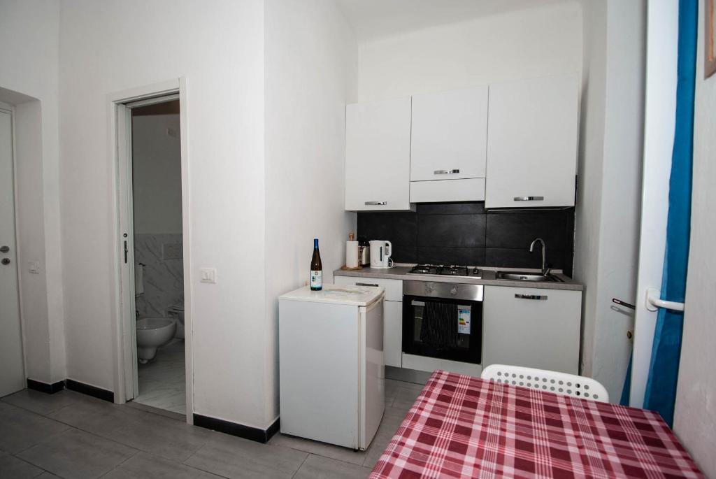 Kuchyň nebo kuchyňský kout v ubytování Casa Di Mezzo by Arbaspàa