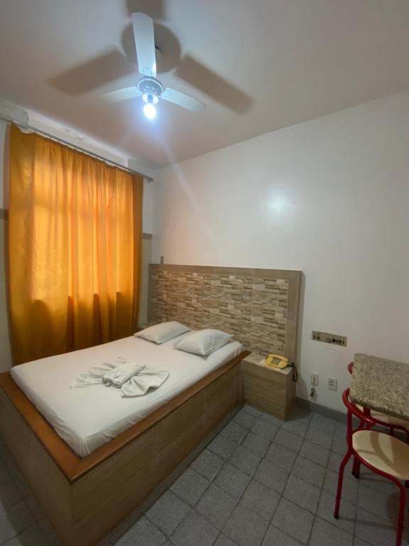 Postel nebo postele na pokoji v ubytování Hotel Bom Gosto