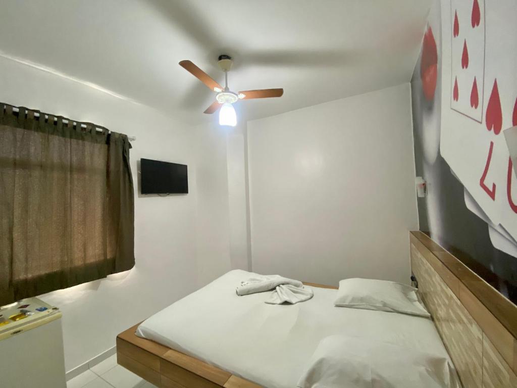 Postel nebo postele na pokoji v ubytování Hotel Bom Gosto