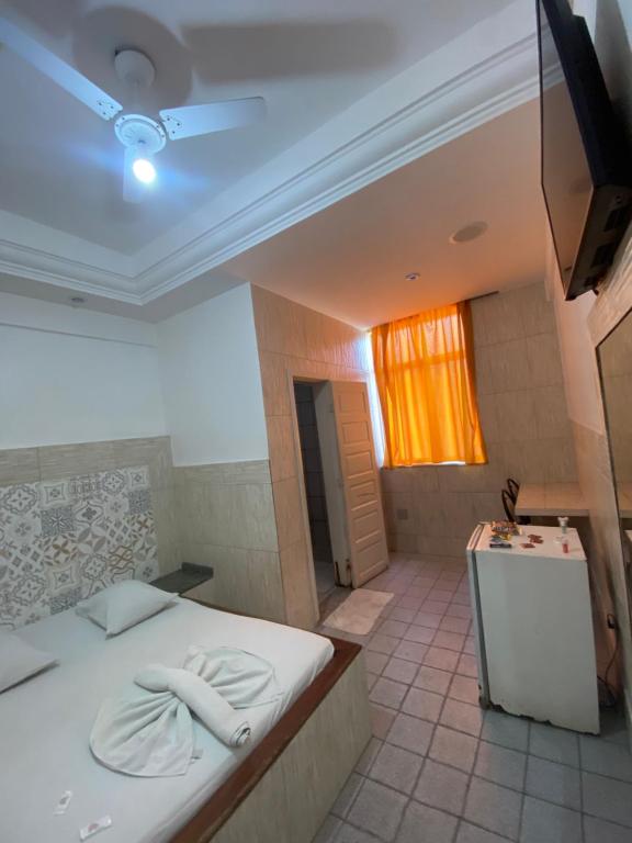 Postel nebo postele na pokoji v ubytování Hotel Bom Gosto