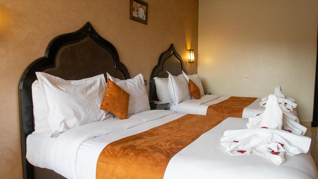Postel nebo postele na pokoji v ubytování Hotel Imperial Plaza & Spa