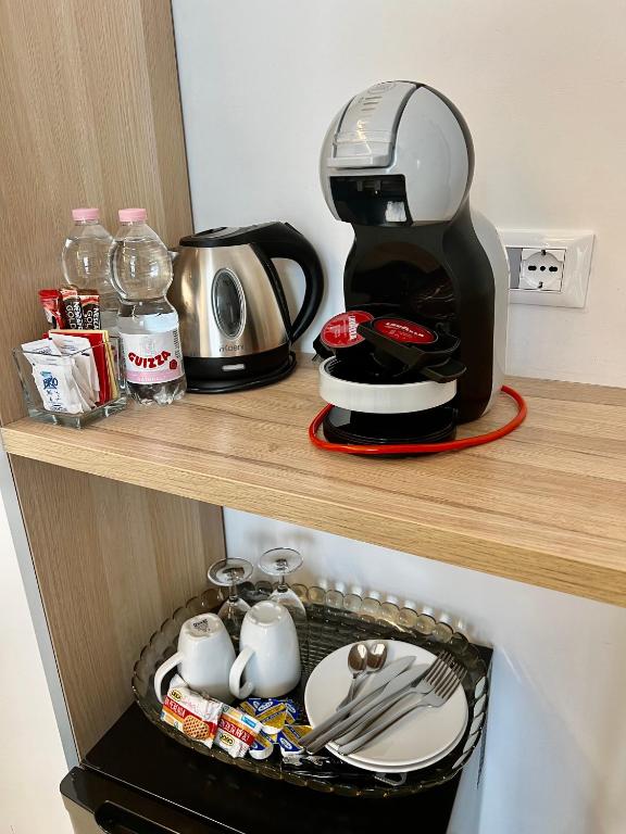 Příslušenství pro přípravu čaje a kávy v ubytování Sunset rooms