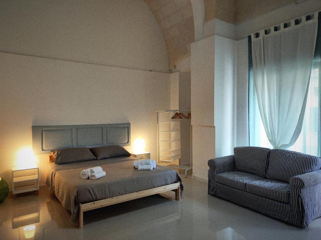 Ένα ή περισσότερα κρεβάτια σε δωμάτιο στο La Piazza
