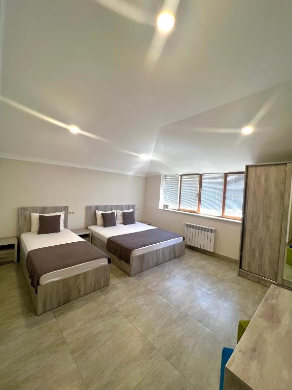 Postel nebo postele na pokoji v ubytování Hotel Menua