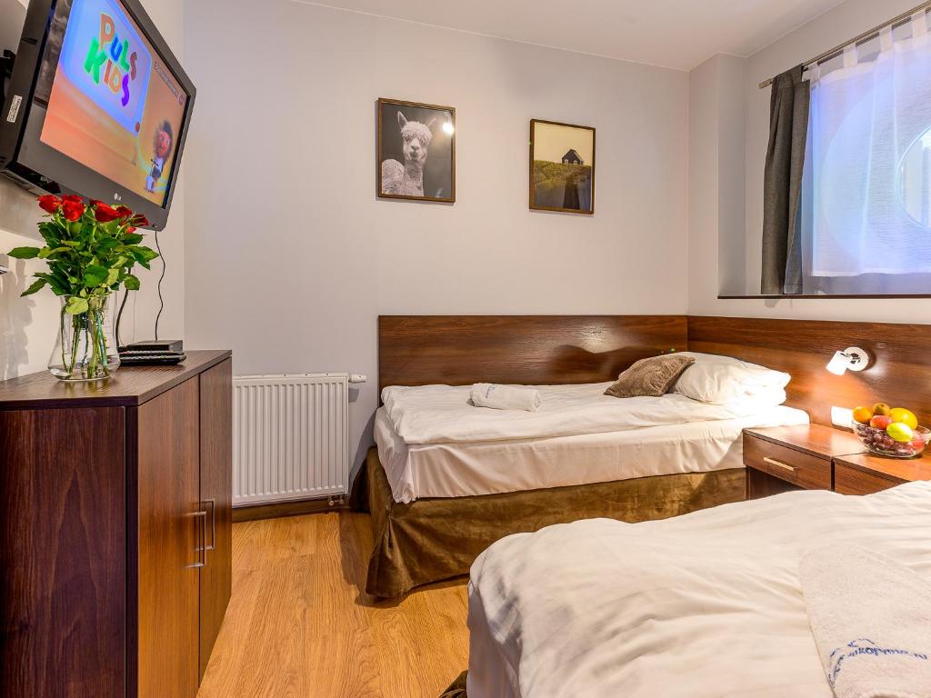 Posteľ alebo postele v izbe v ubytovaní VisitZakopane - Dubaj Apartment