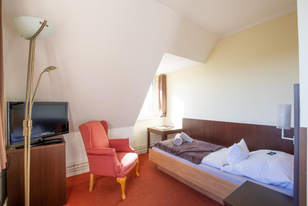 Postel nebo postele na pokoji v ubytování Hotel MeerLand Pellworm