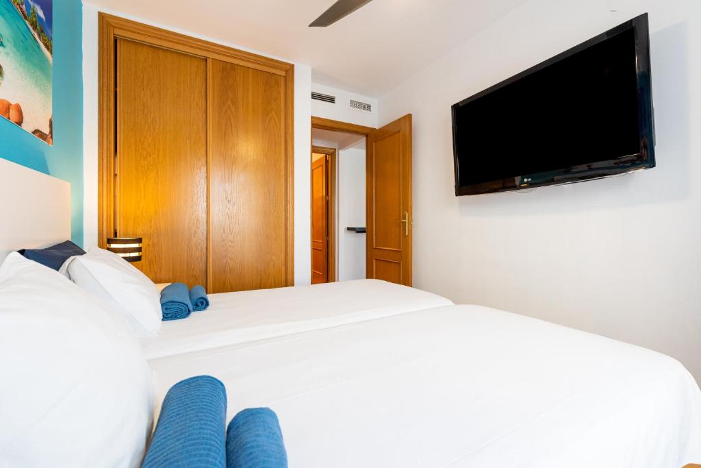 A bed or beds in a room at San Miguel Centro