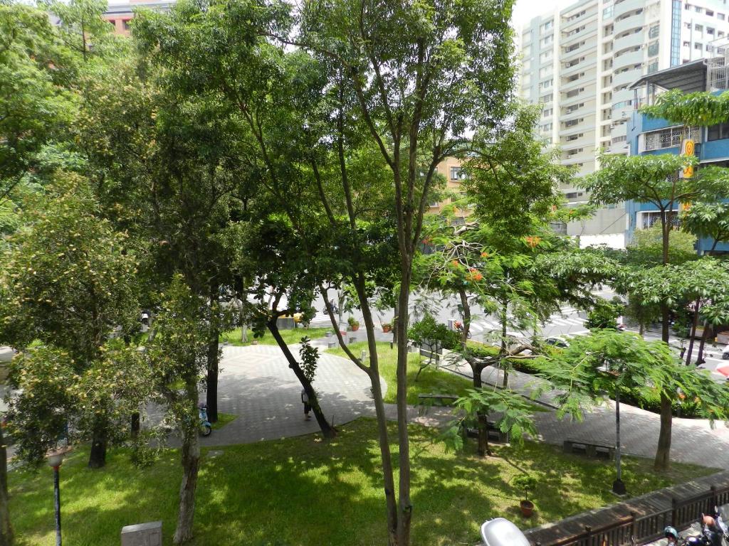 a view of a park with trees and a river at @ Tainan Inn in Tainan