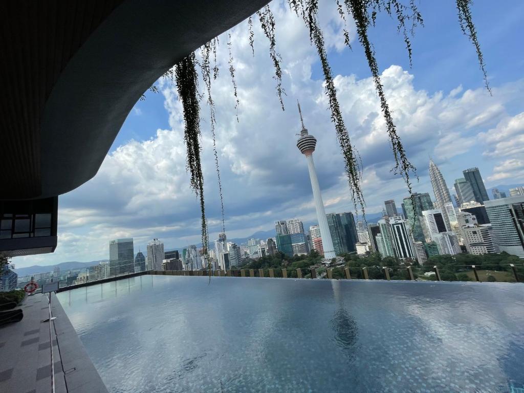 a view of the city from the rooftop of a skyscraper at Ceylonz Suite in Kuala Lumpur