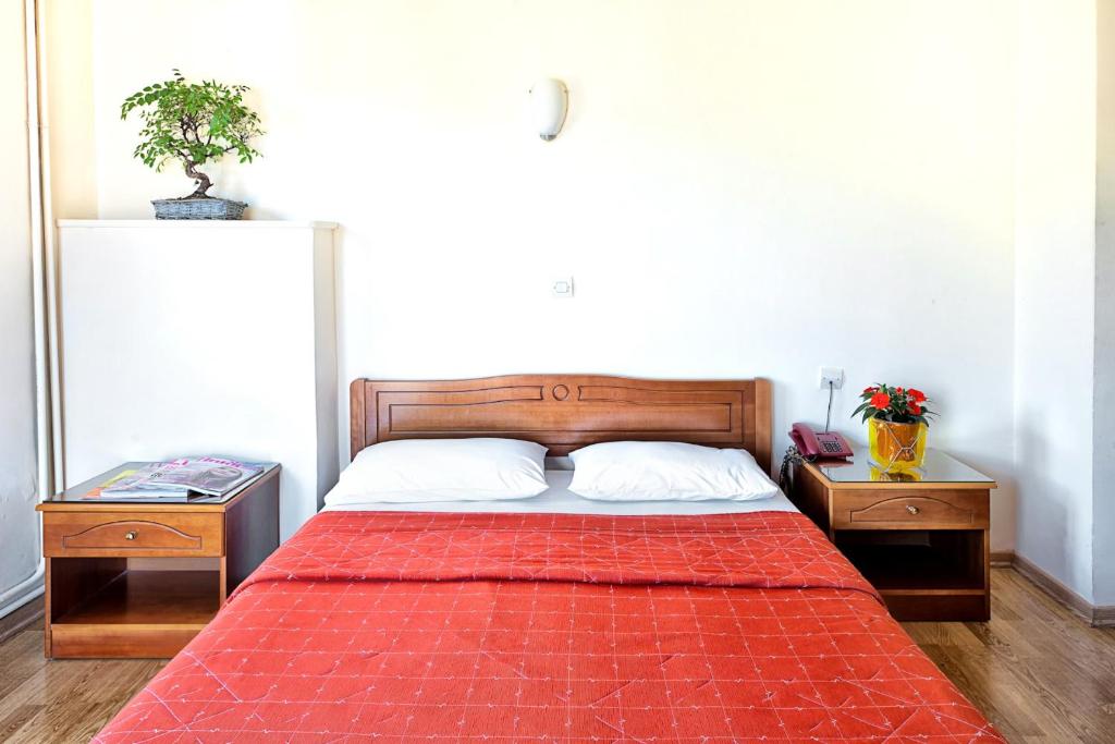 Postel nebo postele na pokoji v ubytování Keletron Hotel - Bike and motorcycle friendly hotel