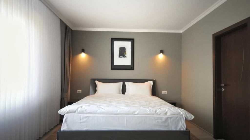 Postel nebo postele na pokoji v ubytování Hotel Callisto
